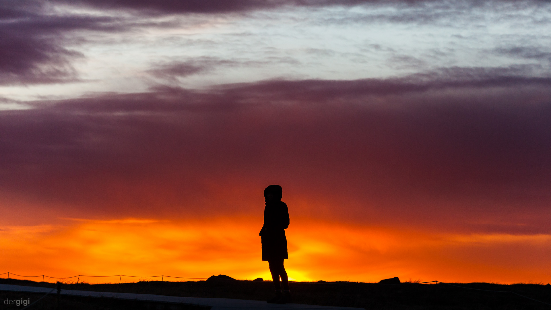 A single silhouette in front of a red sundown